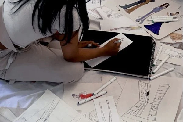 Student sketching designs
